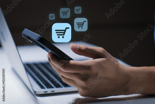 Business ecommerce concept. Man use mobile smart phone with online shopping icons for Internet shopping, online purchase, ecommerce store, online business, shopping on the internet.