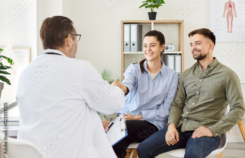 Doctor or psychologist congratulating patients, consulting young couple, marriage counseling, family therapy, fertility treatment for infertility care, support therapist helping on medicine meeting