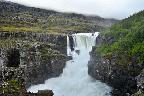 Beautiful waterfall over natural rocks