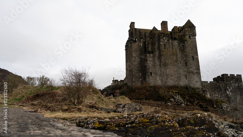 Eilean donan castle rising on a cloudy day in scotland