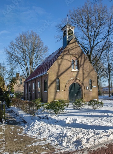 Church in winter time in the snow at the village of Uffelte Drenthe Netherlands. photo