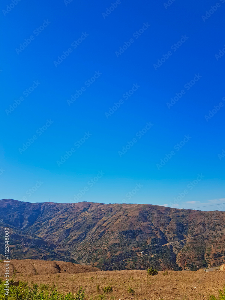Serene Rustic Mountain Landscape on a Sunny Day Serene Rustic Mountain Landscape on a Sunny Day