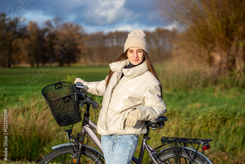 Woman Riding Bicycle, Natural Skin, Exploring Outdoors, Enjoying Nature photo