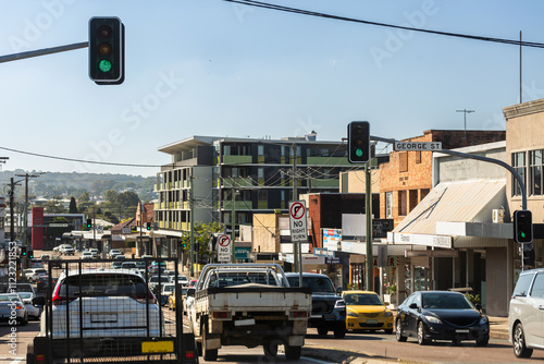 Busy street with traffic and no right turn sign on city street photo