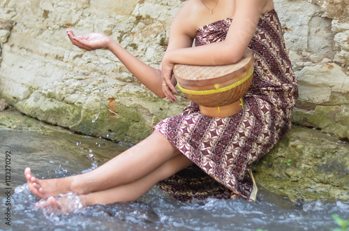 Country girls bathe in river water