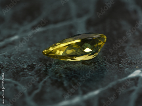 golden yellow citrine gemstone, on a black-white backgrond black-white marble