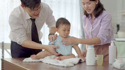 Asian baby and families who have to work while raising children at home
