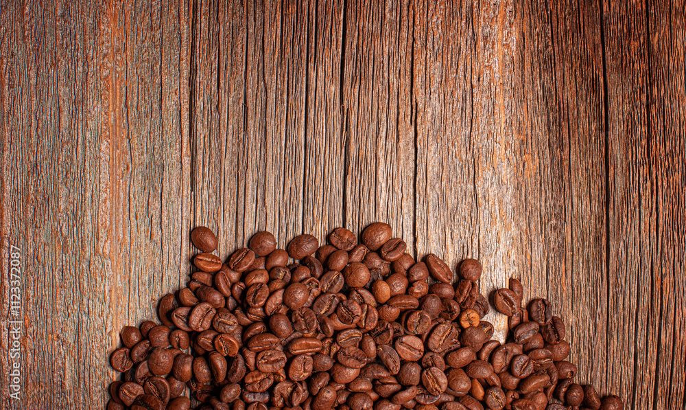 Close-up of coffee beans. Coffee beans on wooden background.