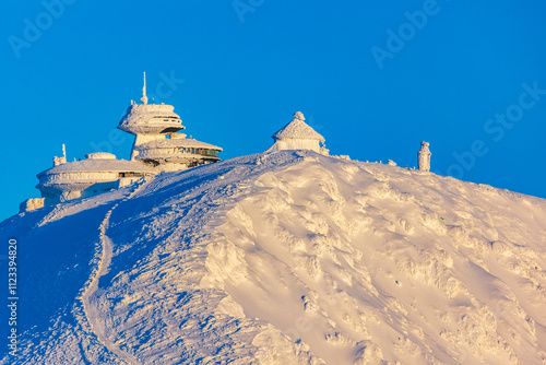Śnieżka summit in Karkonosze Mountains during winter sunset