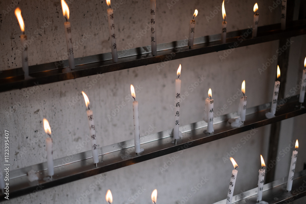 Burning worship candles in the Buddhist Temple