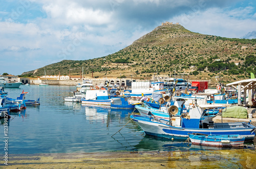 Fishing boats in harbour on...