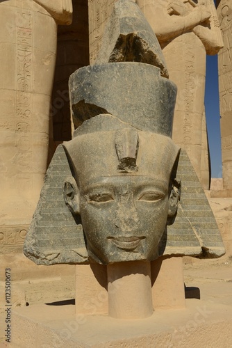 Temple of Ramesseum, Luxor, Egypt, Africa. The colossus statue remains of Ramese II. photo