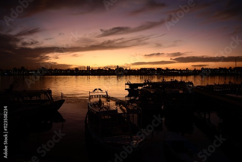 The Nile, Luxor City, Egypt, Africa, sunrise view from the West bank on a very calm morning.