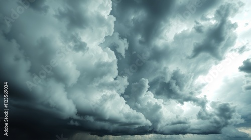 Dark storm clouds gather ominously over the horizon before a heavy rainfall b...