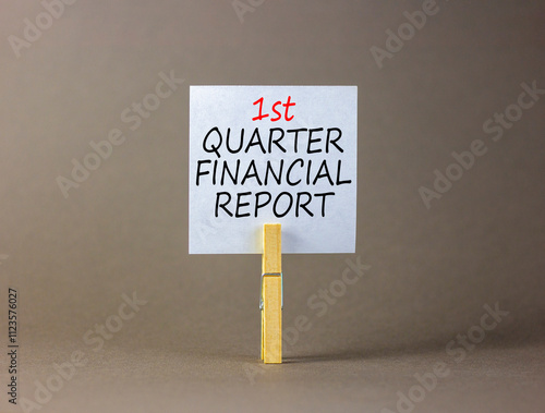 1st quarter financial report symbol. Concept words 1st quarter financial report on beautiful white paper. Beautiful grey background. Business 1st quarter financial report concept. Copy space. photo