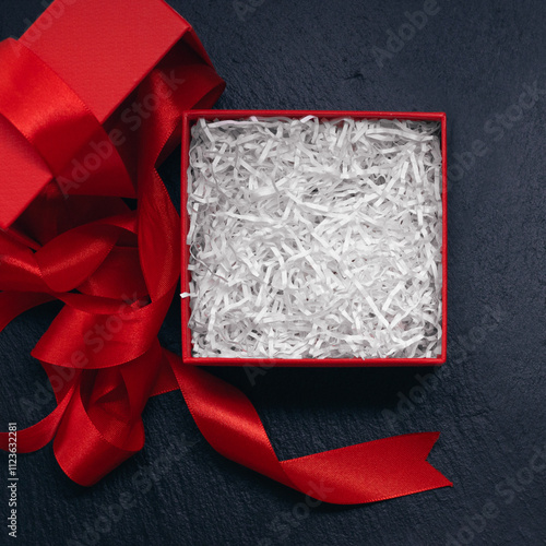 open red gift box with filling, top view