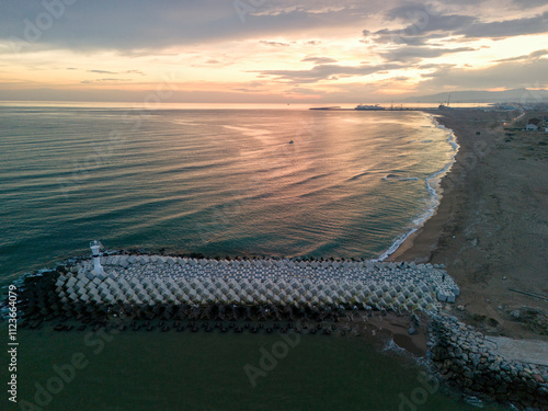 Turkey Sakarya Adapazari Karasu Aerial View of Coastal Breakwater at Sunrise. High-angle shot of a breakwater structure extending into the ocean at sunrise. Drone shot. Holiday advertising photo nice photo