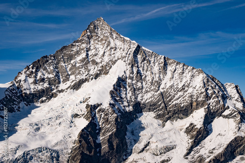 Autumn landscape of high alpine mountains in Switzerland with Matterhorn in the background