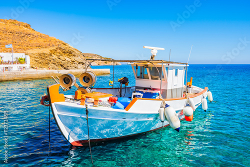 Obraz na płótnie Colourful traditional fishing boat anchoring in small port of Motsouna village, Naxos island, Cyclades, Greece w salonie