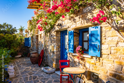 Obraz na płótnie Typical Greek style apartments decorated with colorful flowers in Galini village, Naxos island, Cyclades, Greece w salonie