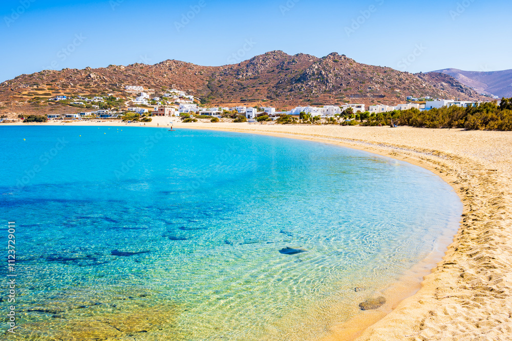 Idyllic sandy beach of Orkos bay and calm crystal clear azure sea water, Naxos island, Cyclades, Greece