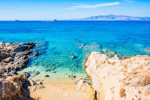 Obraz na płótnie Rocks and stones on idyllic sandy beach of Orkos bay and calm crystal clear azure sea water, Naxos island, Cyclades, Greece w salonie
