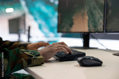 Military power base under ruling of army IT professional who analyzes registered data about a new national guard operation. Division commander major gathers intelligence for his troops. Close up. photo