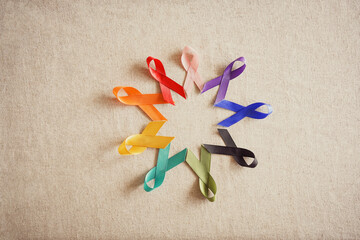 multi colored ribbons in circle, cancer awareness, World cancer day, world autism awareness day, pride day concept