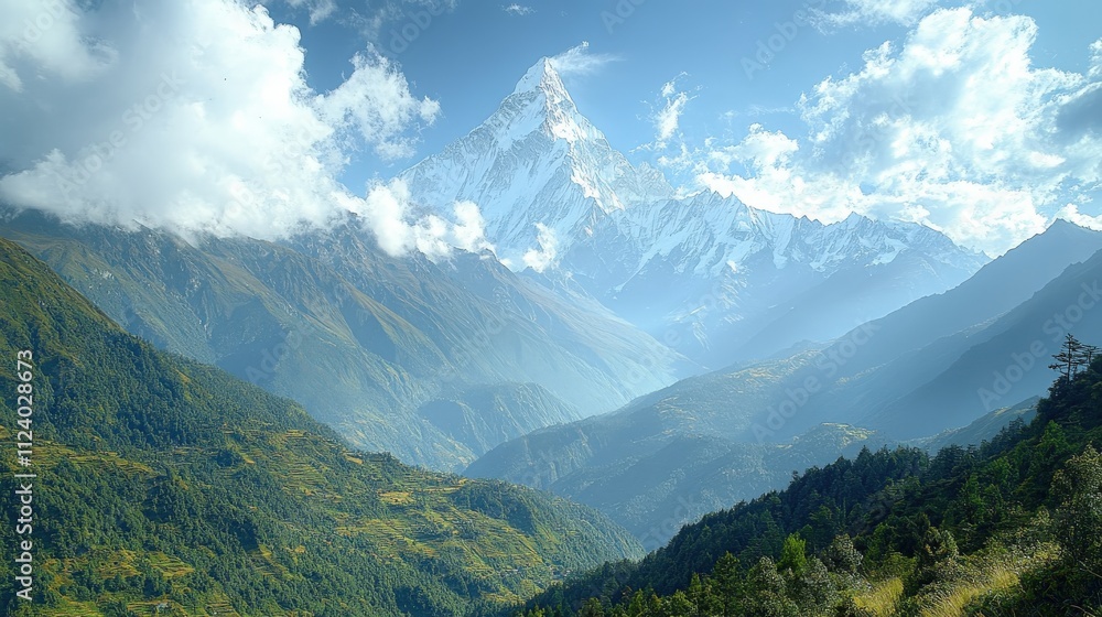 Naklejka premium Majestic mountain landscape with peaks, valleys, and clouds under a bright sky.