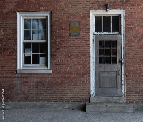 Vintage Brick Building Facade with Fallout Shelter Sign in New York City