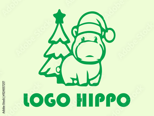 Green hippo with hat beside mini Christmas tree, perfect for holiday greeting cards, festive designs, childrens illustrations, and seasonal graphics photo