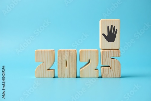 Wooden Blocks Forming Two Thousand Twenty Five With Hand photo