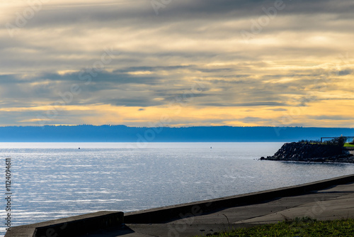 2023-12-31 VIEW OF A SALM PUGET SOUND WITH A NICE CLOUDY SKY FROM A BULKHEAD ON WHIDBEY ISLAND WASHINGTON-Edit-Edit.tif photo