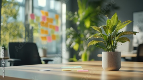 A tranquil office space with a plant and colorful sticky notes on the wall.