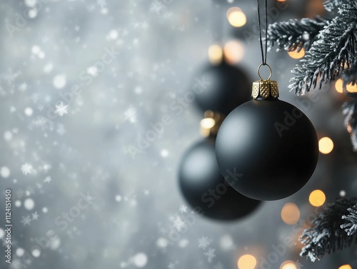 A serene winter scene featuring black Christmas ornaments hanging from a frosted tree, illuminated by soft, glowing lights against a snowy backdrop.
