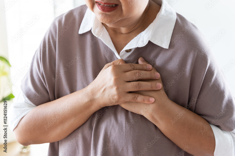 Chest pain, attack chest, emergency heartbeat asian senior woman holding hand on chest, suffering symptom from pain, heart disease problem of aged anxiety cardiac. Health care of cardiology concept. Chest pain, attack chest, emergency heartbeat asian senior woman holding hand on chest, suffering symptom from pain, heart disease problem of aged anxiety cardiac. Health care of cardiology concept.