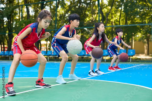 Chinese Kids Warming Up During Basketball Training Class