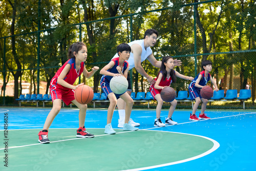Chinese Kids Warming Up During Basketball Training Class
