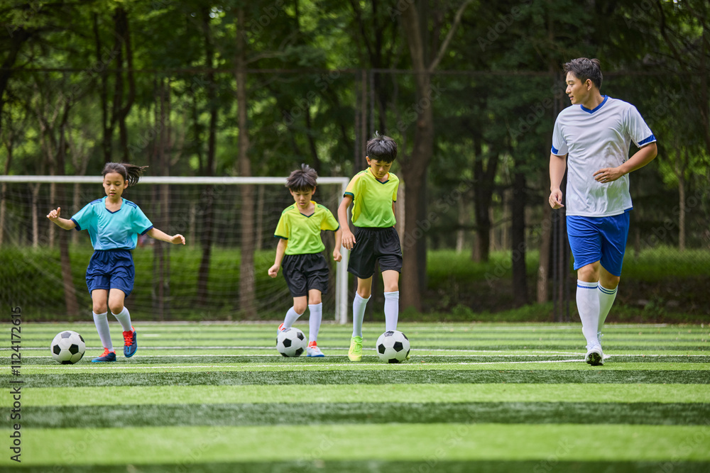Chinese Coach and Kids in Football Training Class Chinese Coach and Kids in Football Training Class