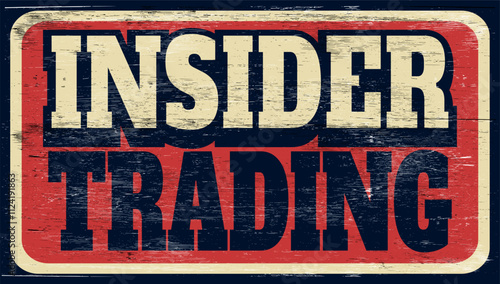 Aged and worn insider trading sign on wood