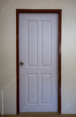 Wallpaper Mural Wooden door in a room with a closed entrance and brown frame. Torontodigital.ca