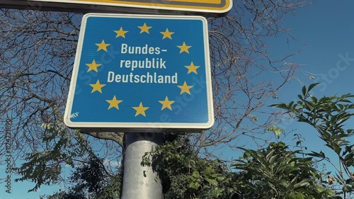 Entrance traffic sign to Germany national Republic next to a travel route photo