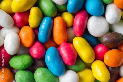 Bright multi-colored candies. Round dragee top view. Sweet colored spherical candies