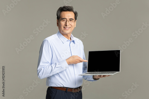 Senior male entrepreneur with laptop photo