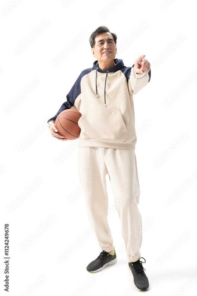 Happy senior Chinese man playing basketball Happy senior Chinese man playing basketball