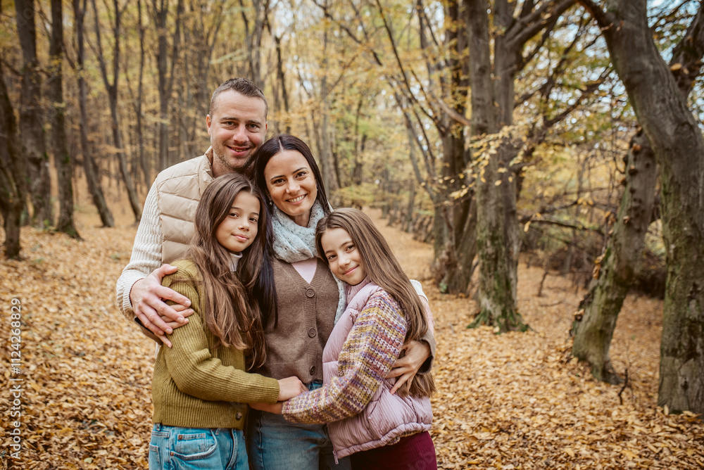 Family portrait of parents with two daughter, standing in the middle of forest. Family portrait of parents with two daughter, standing in the middle of forest.