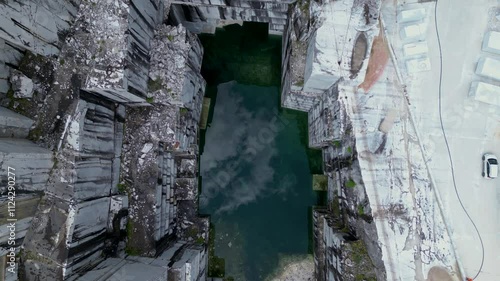Aerial view of the blue lake of the marble quarry Valsora Massa Carrara Tuscany Italy