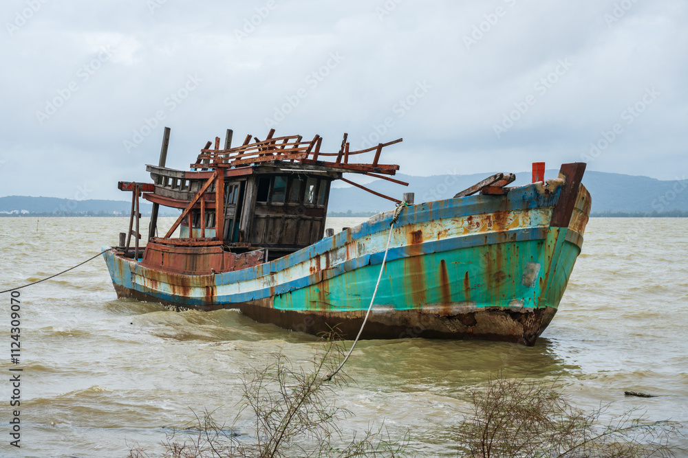 shipwreck near the coast on a cloudy day. Songkhla, Thailand. shipwreck near the coast on a cloudy day. Songkhla, Thailand.