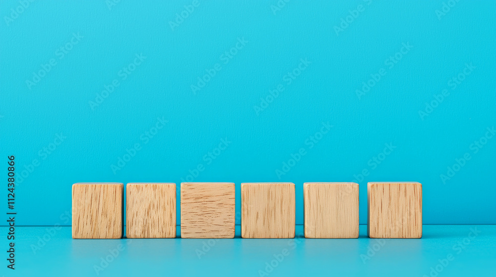 New Year 2025 with Wooden Blocks concept. Wooden blocks arranged on a vibrant blue background. New Year 2025 with Wooden Blocks concept. Wooden blocks arranged on a vibrant blue background.