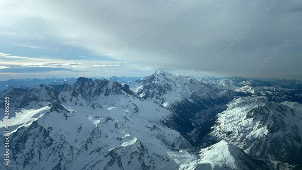 Aerial View Of Mountain Alps Covered With Snow In Winter. Aerial View Of Mountain Alps Covered With Snow In Winter.